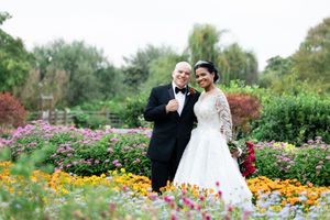 Outdoor garden setting with colorful flowers and blooming marigolds creating a romantic backdrop.