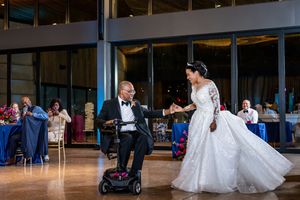 Indoor wedding reception venue with elegant lighting and dance floor setup.