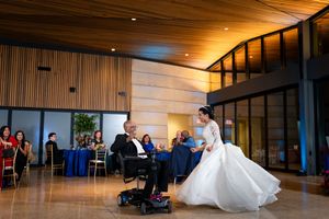 Modern wedding venue interior with wooden panels and warm lighting.