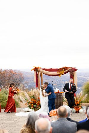 Outdoor wedding ceremony with mountain views and fall foliage decorations. Sparta New Jersey Wedding Photographer