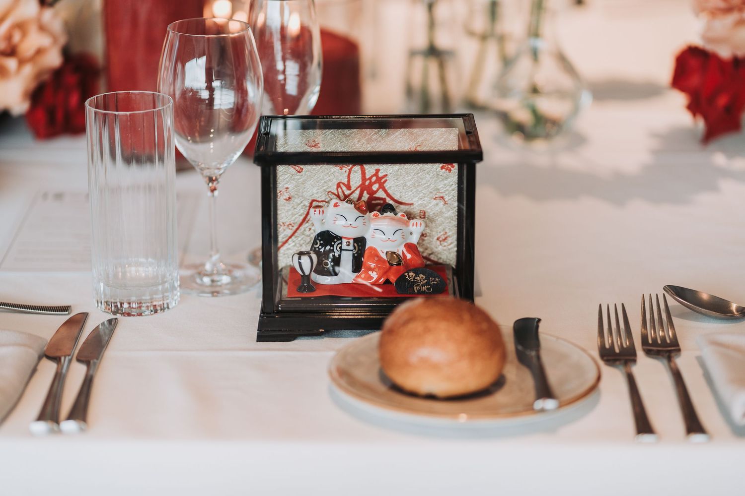 Wedding reception table setting with decorative frame and place setting.