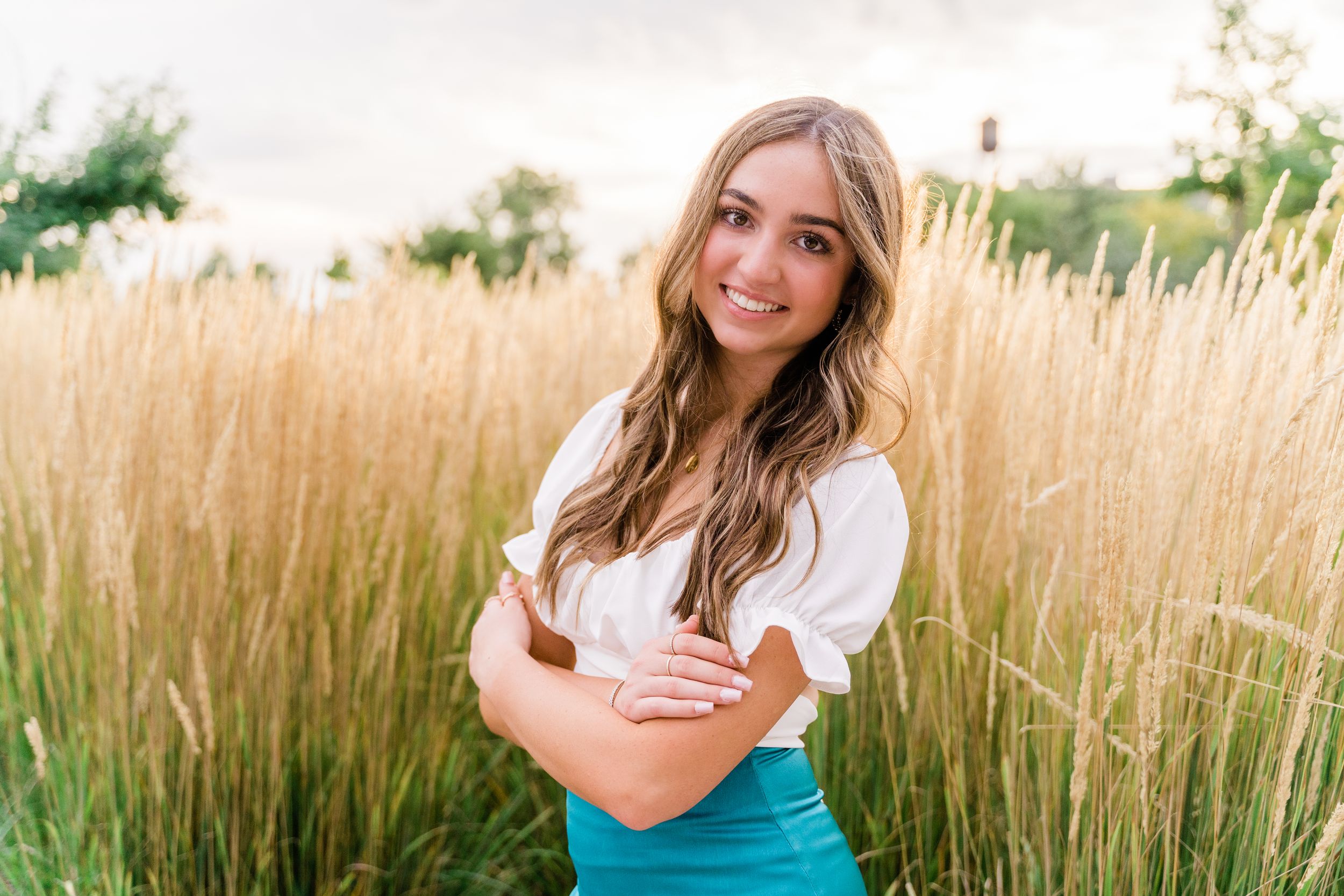 A series of sunset portraits captured in a golden wheat field with warm evening light.