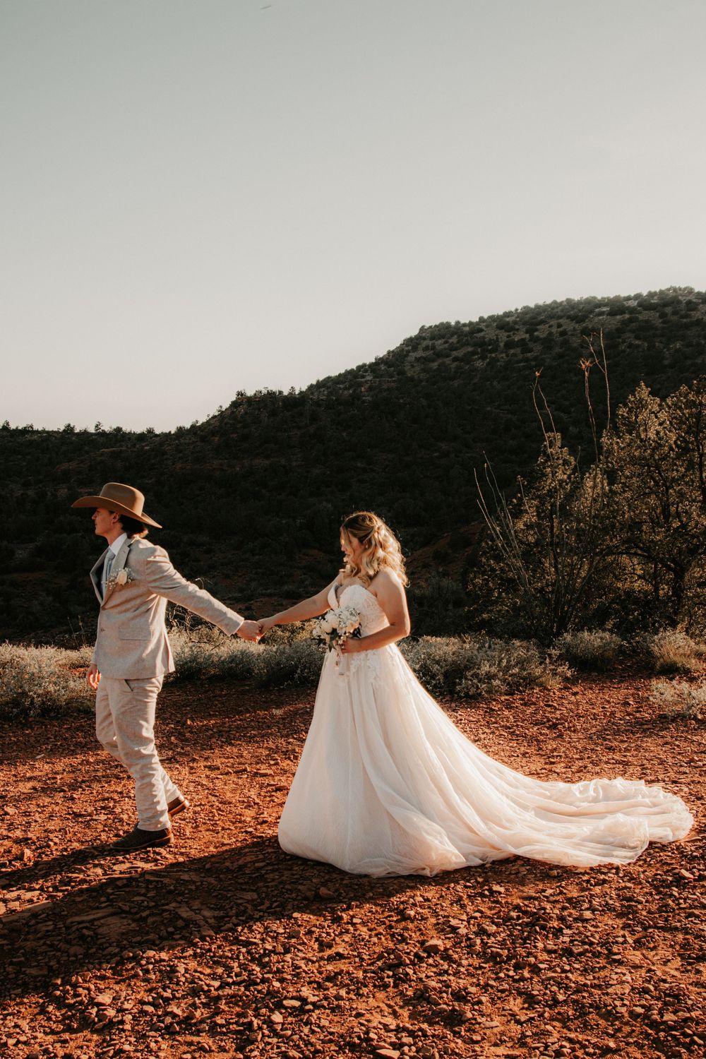 Sunset elopement photography in Sedona featuring authentic emotional moments.