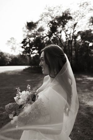 A romantic wedding photoshoot sequence showing a bride in a flowing veil against a sunset backdrop.