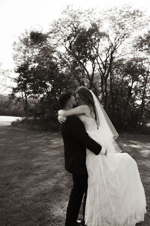 A series of romantic dance poses between newlyweds in an outdoor setting.
