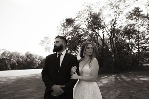 Wedding couple shares intimate moments in a scenic outdoor location at sunset.