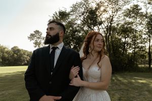 Candid wedding photos capture genuine laughter and joy during an outdoor photo session.