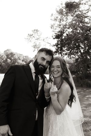 Black and white wedding portraits showing joyful moments between the newlyweds.