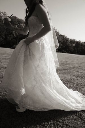 Artistic black and white shots highlighting the details of a wedding dress outdoors.