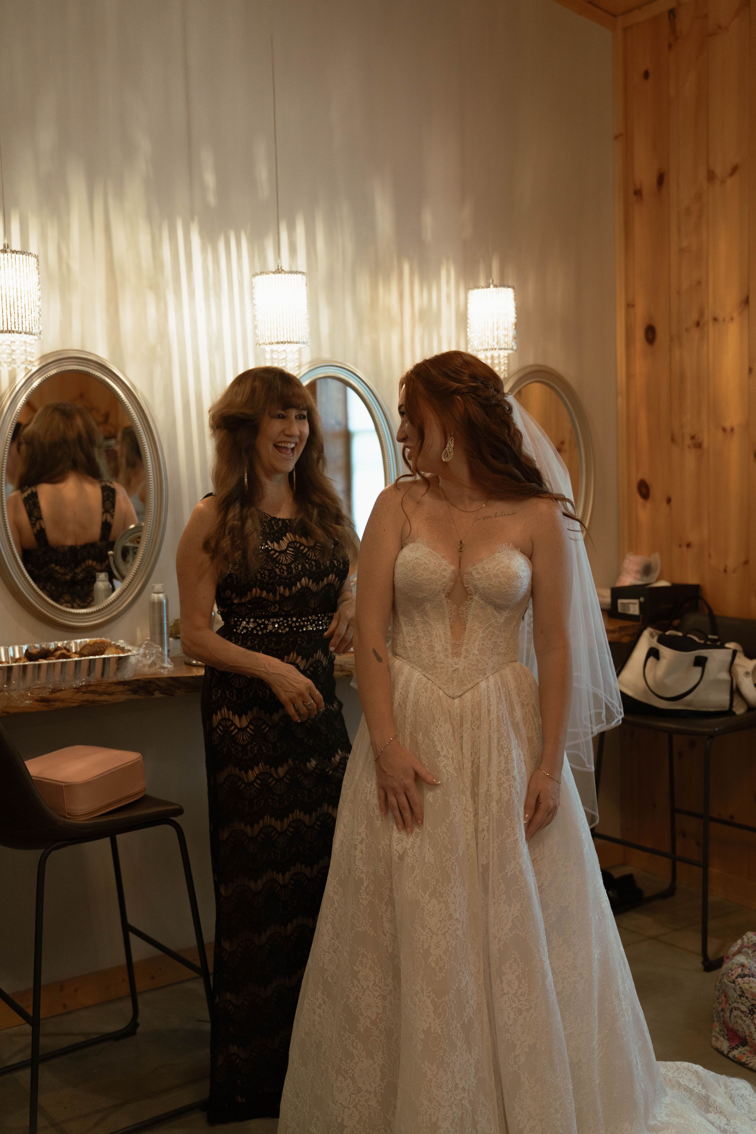 Interior of bridal preparation room with mirrors and natural wood paneling.