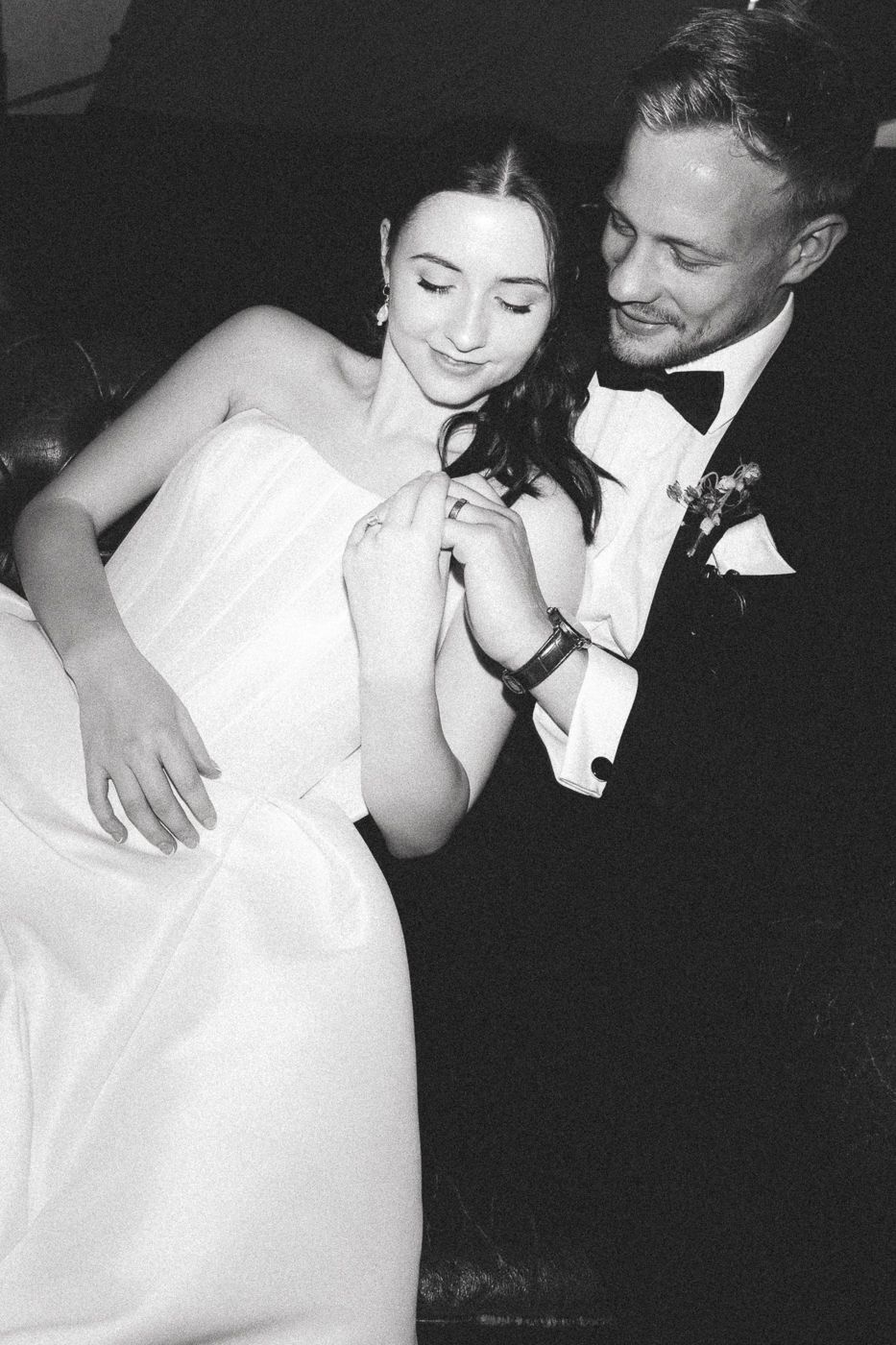 Black and white photos capture intimate moments between a bride in white dress and groom in dark suit during their romantic dance.
