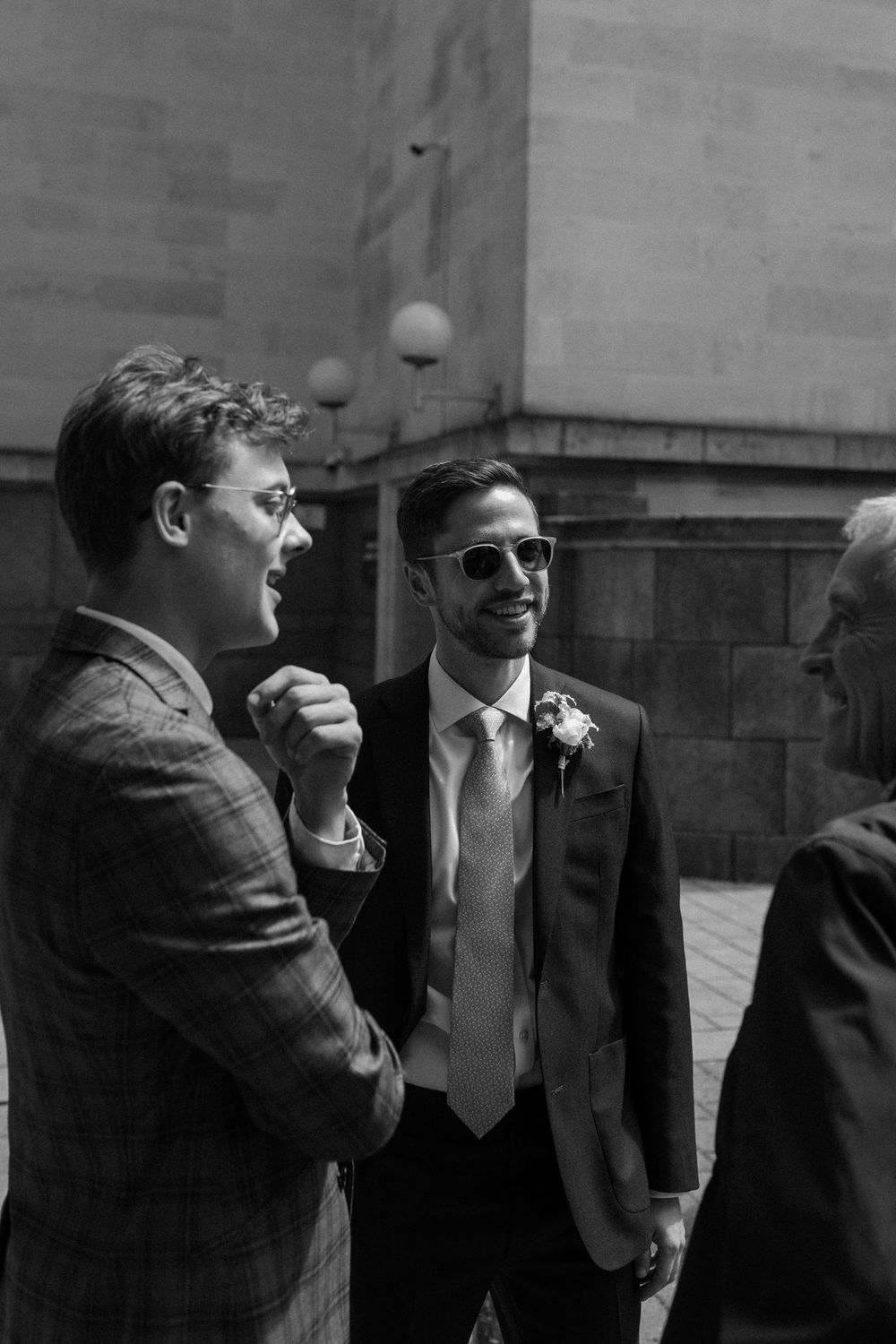 Groom waits outside Islington Town Hall for his wedding.