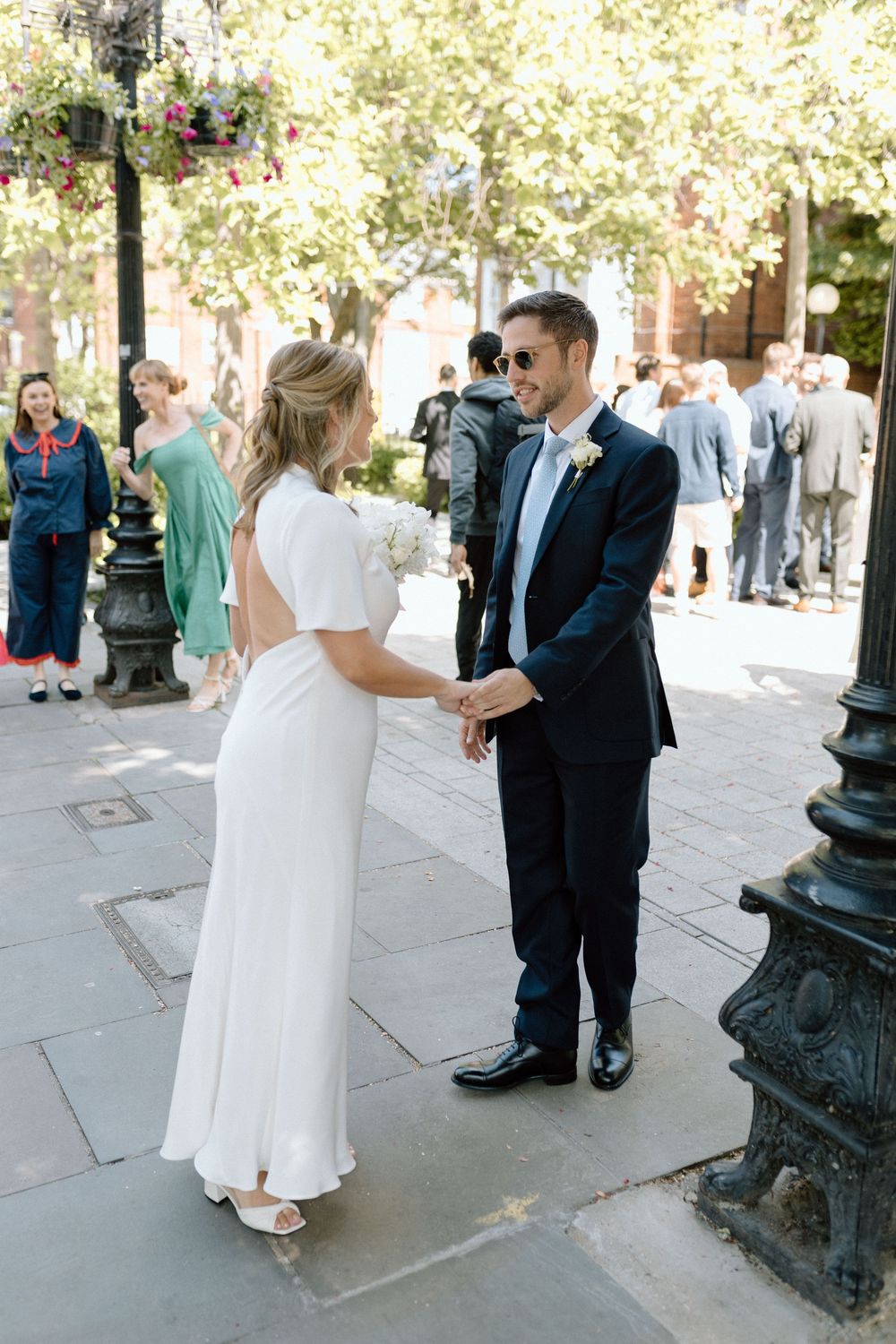 Groom greets his bride during a first look at Islington Town Hall London wedding.