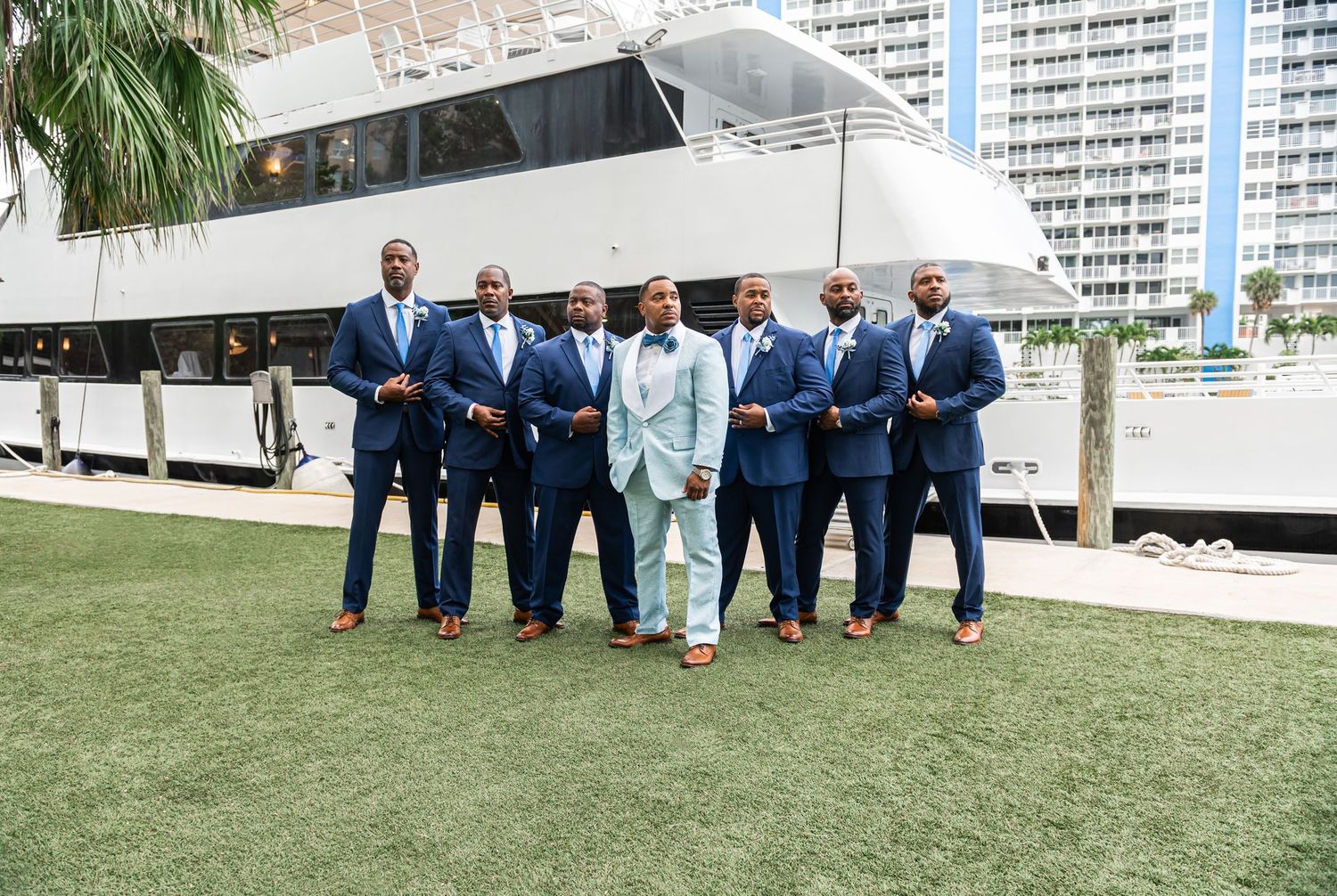 Groom kissing bride’s forehead during South Florida yacht wedding