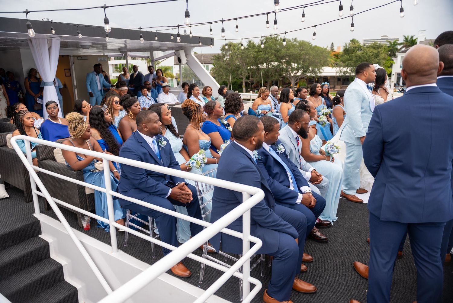Wedding guests wearing different shades of blue at Fort Lauderdale yacht wedding