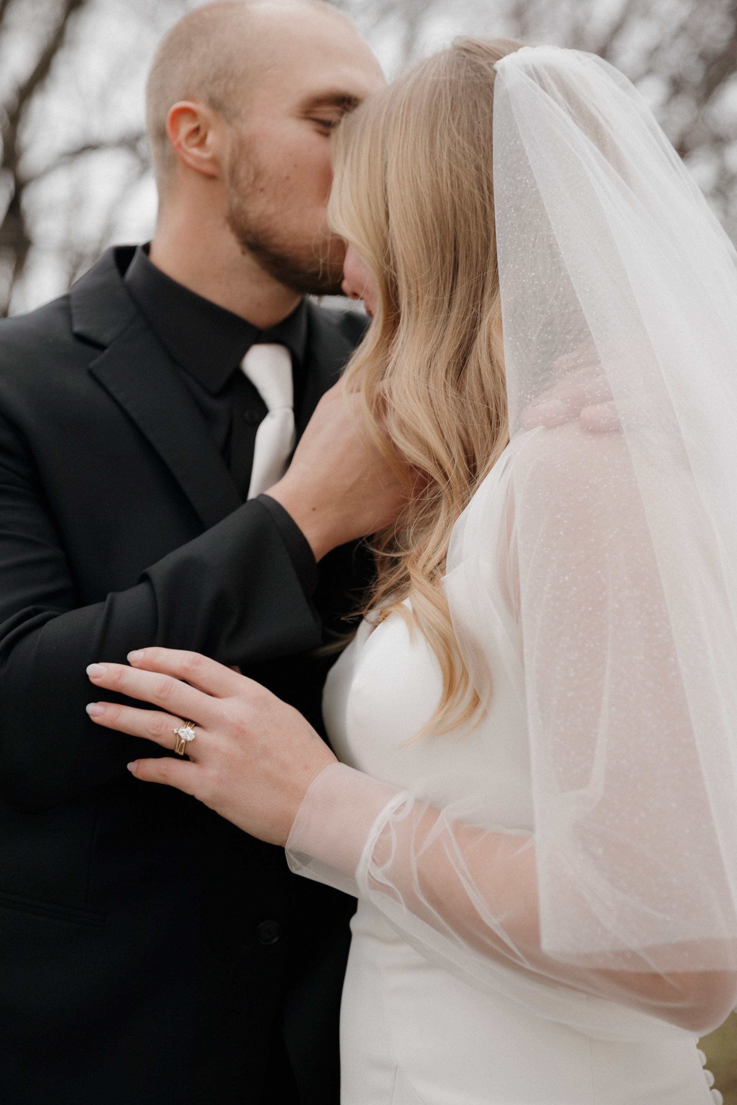 A romantic black and white wedding photo series showing intimate close-up moments between a bride and groom.