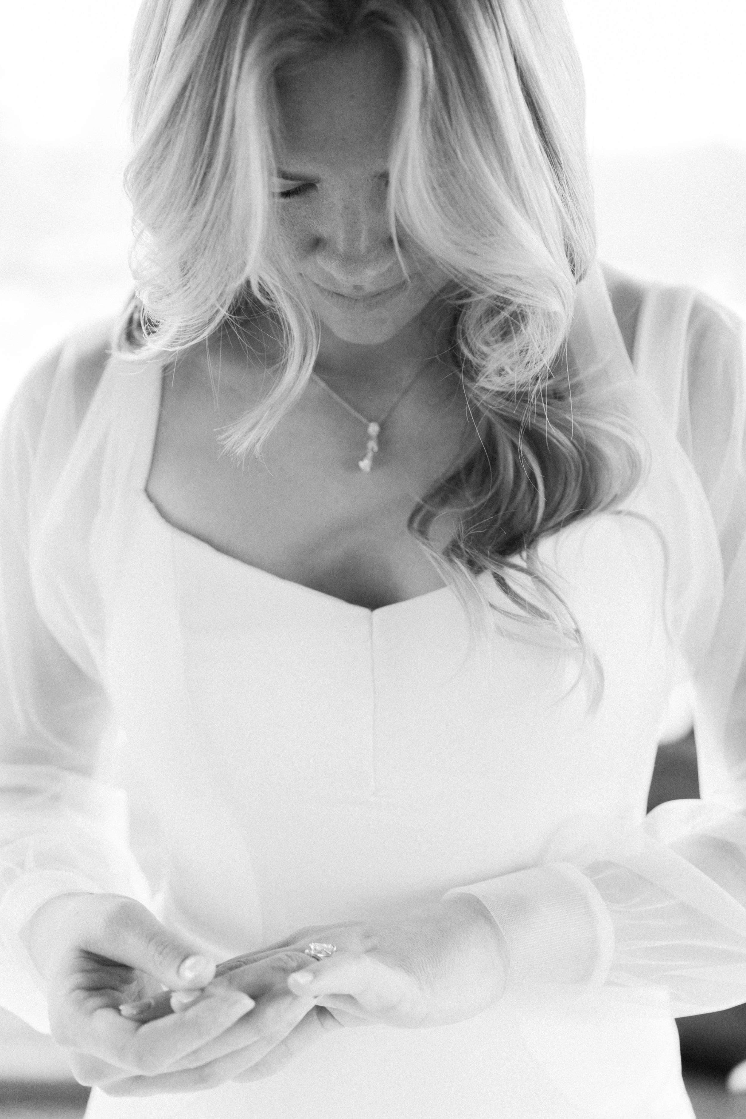 Black and white bridal portraits showing elegant details of a wedding dress.
