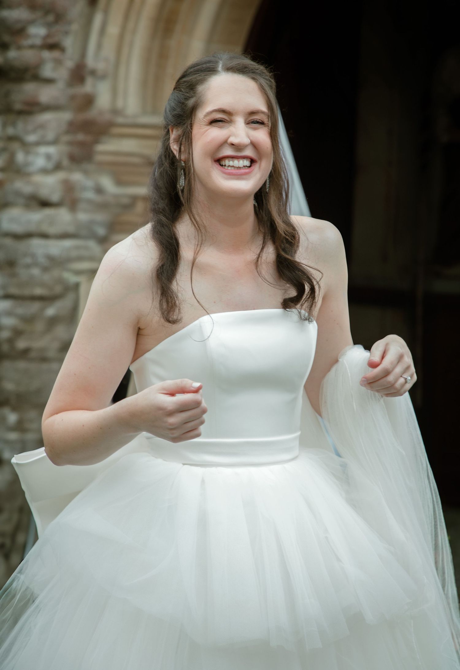 bride wedding dress white dress smiles moments before church ceremony luxury wedding celebrations Photography