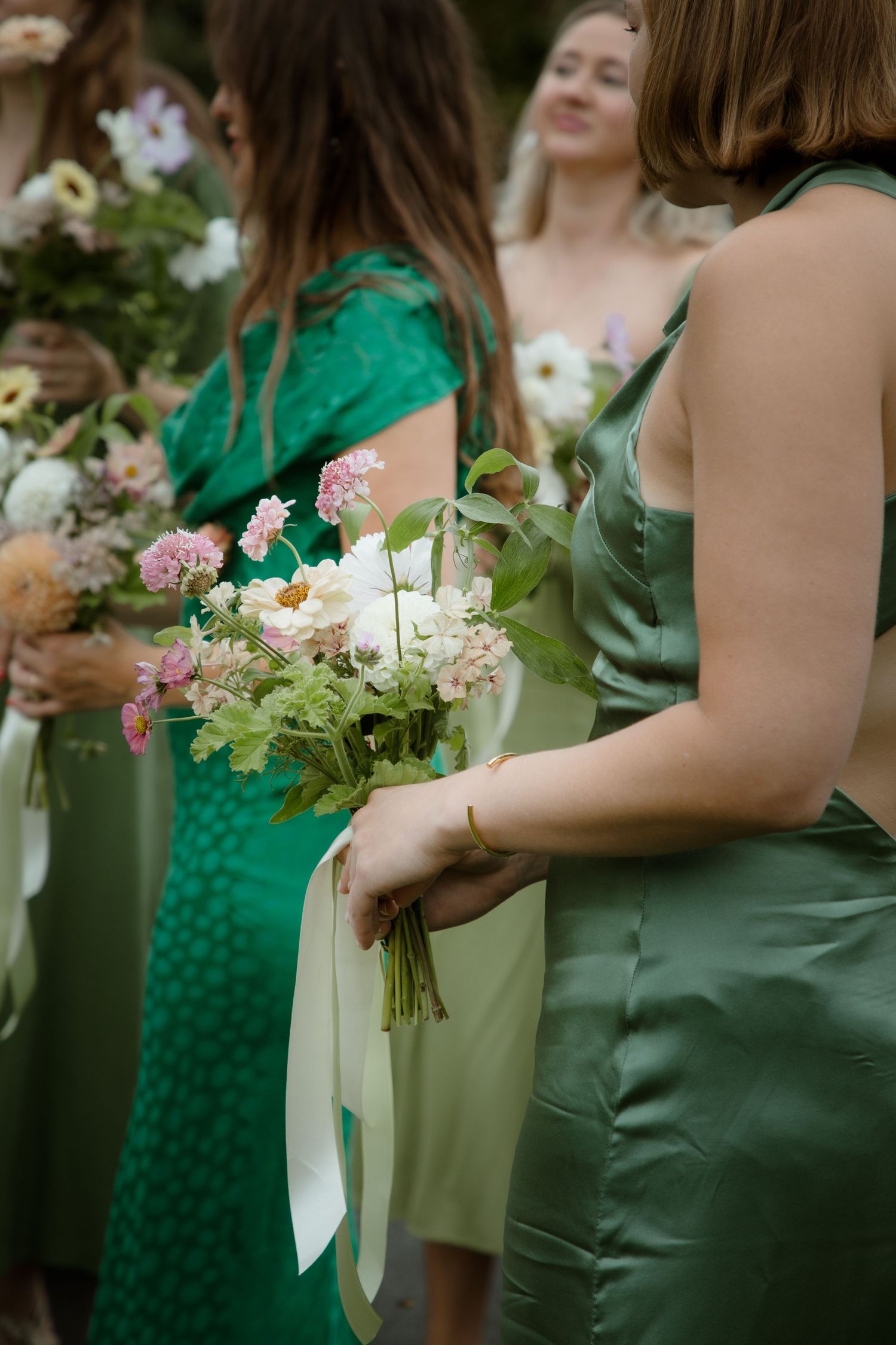 bouquet details bridesmaid green satin dress luxury wedding photography candid