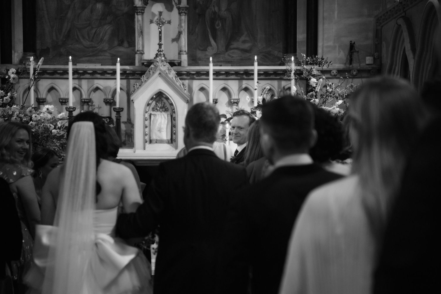 grooms reaction bride walking down the aisle church ceremony editorial wedding