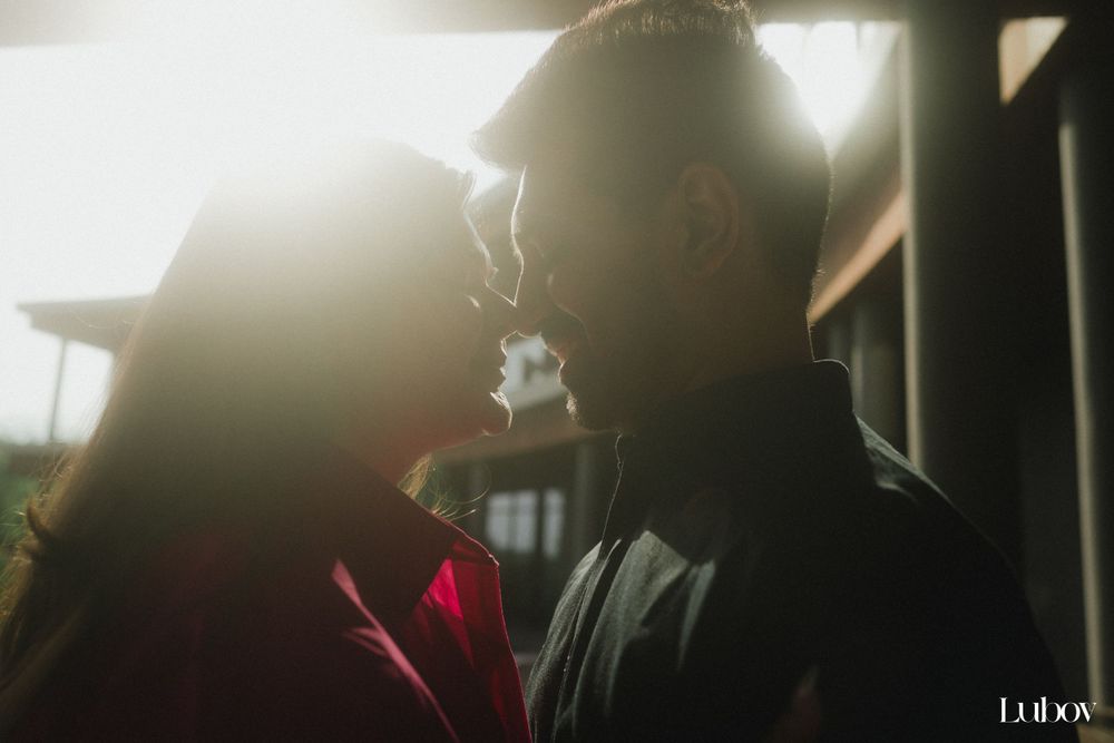 Backlit silhouette portrait with sunflare and atmospheric smoke or vapor.