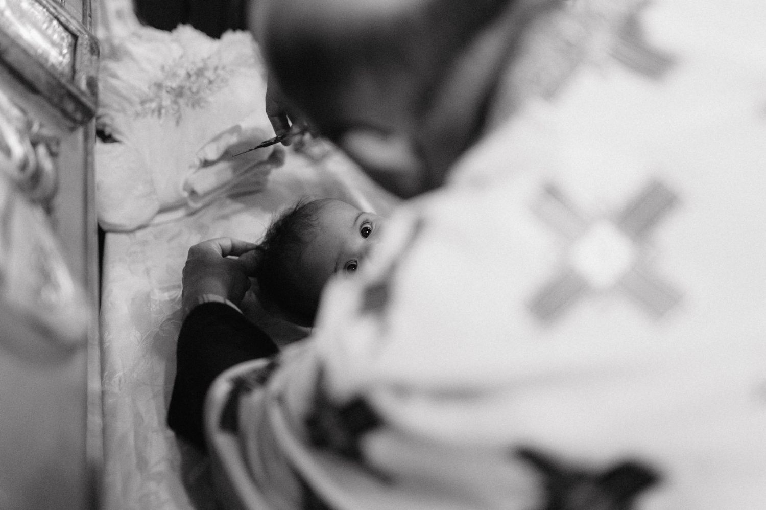 Ethereal black and white close-up photograph shows abstract patterns of light and shadow with soft blurred details.