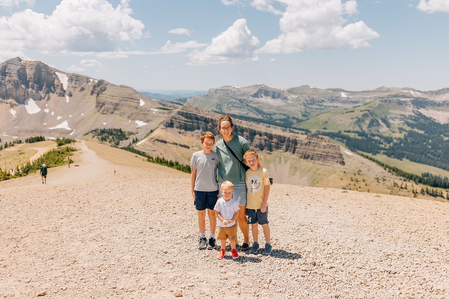 Anna and her children on top of a ski resort mountain in the summer.