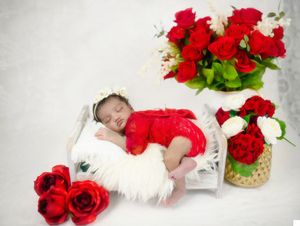 Bhaire  Photography newborn studio session in Frisco, baby sleeping on soft, textured props.
