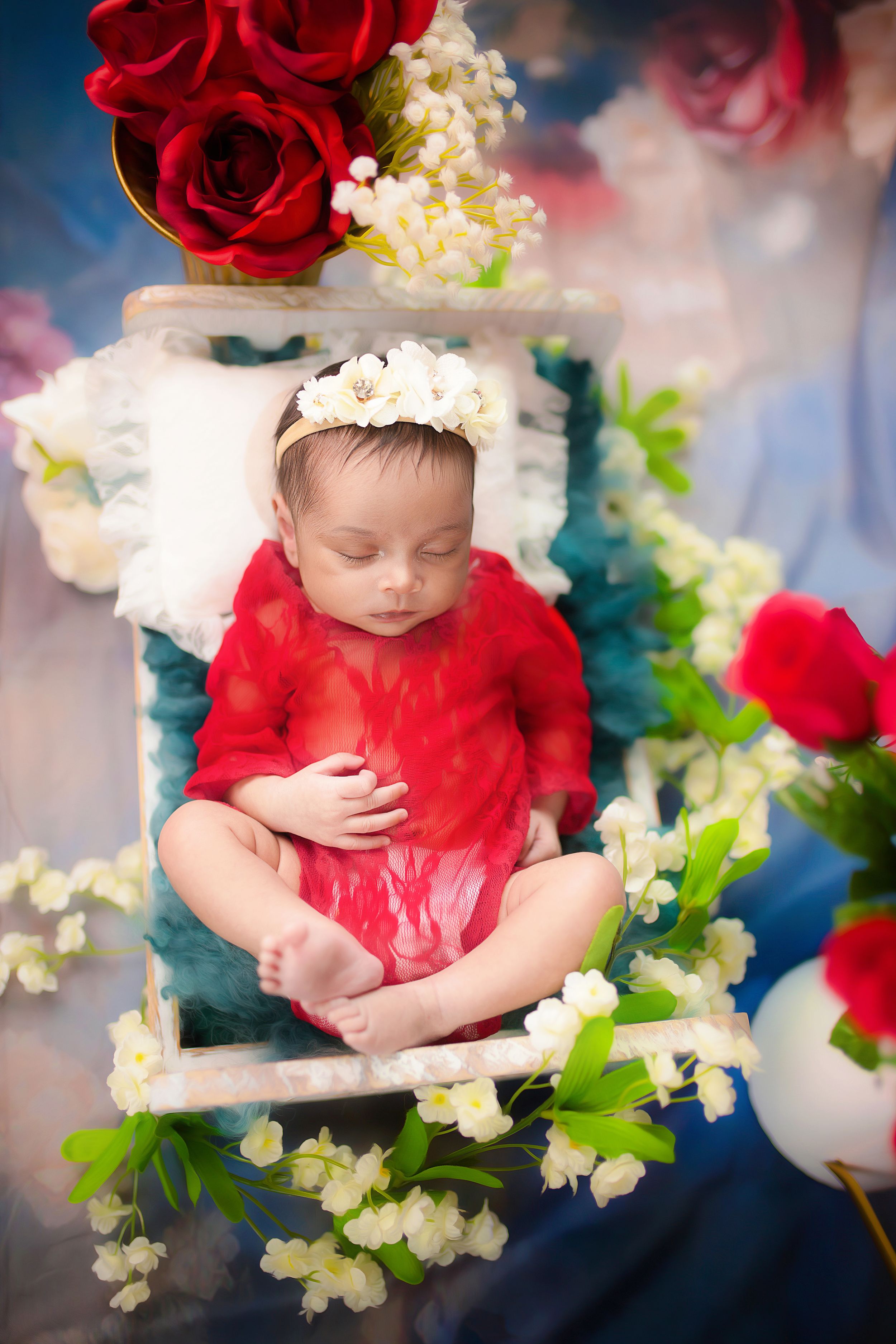 Luxury newborn photography in Dallas by Rimegh Photography, baby swaddled on natural blankets in studio.