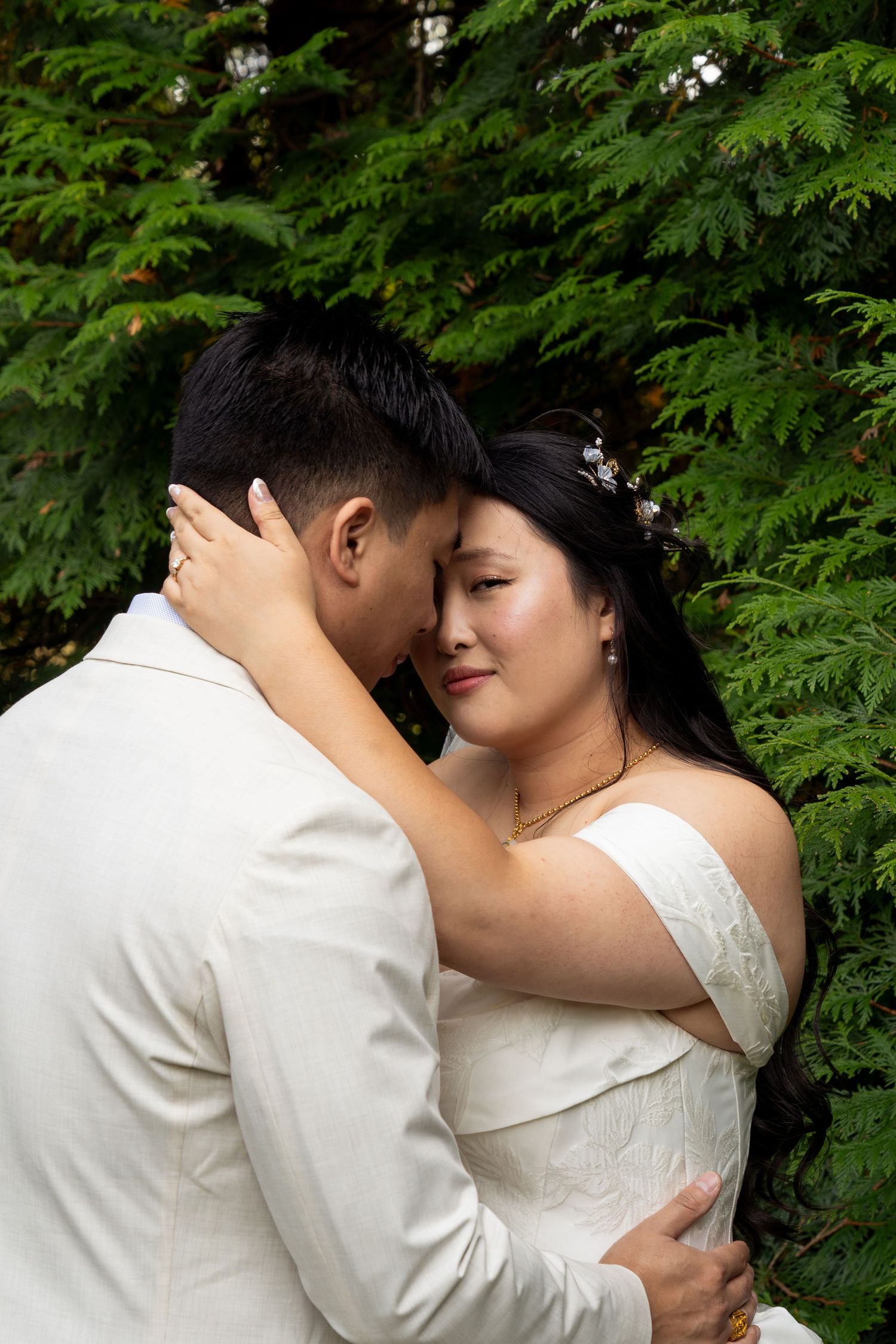 Editorial Image of asian couple with trees behind them
