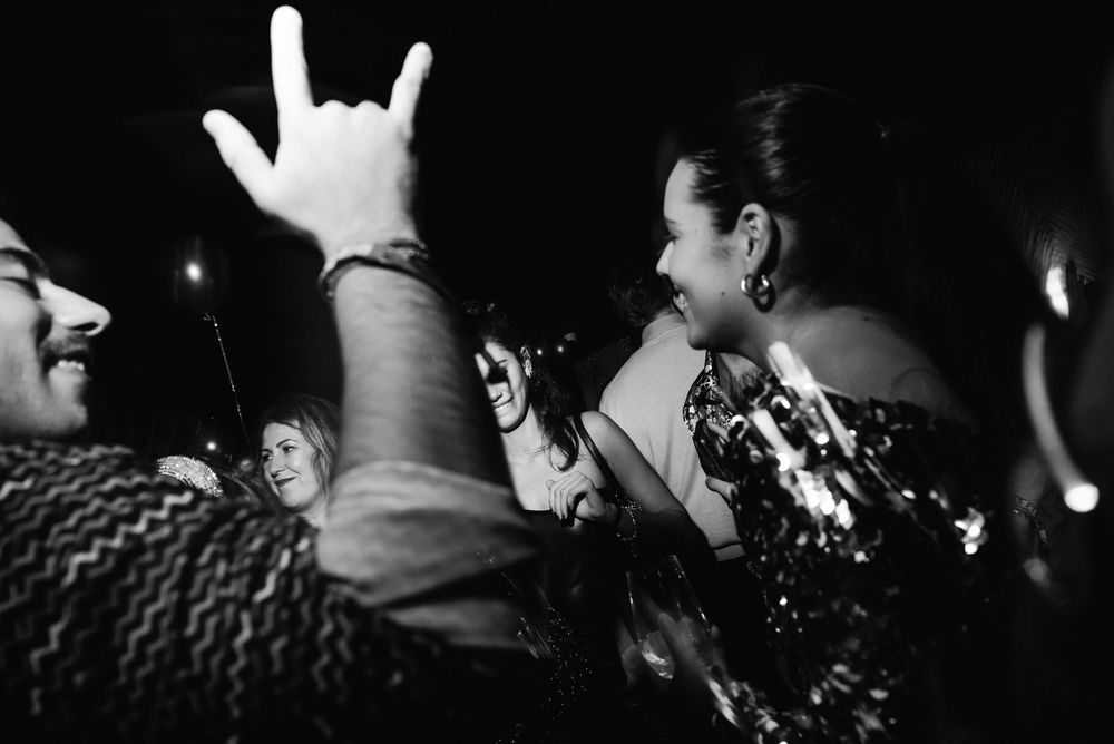 Black and white concert photos showing silhouettes of performers and crowd members at a rock show.
