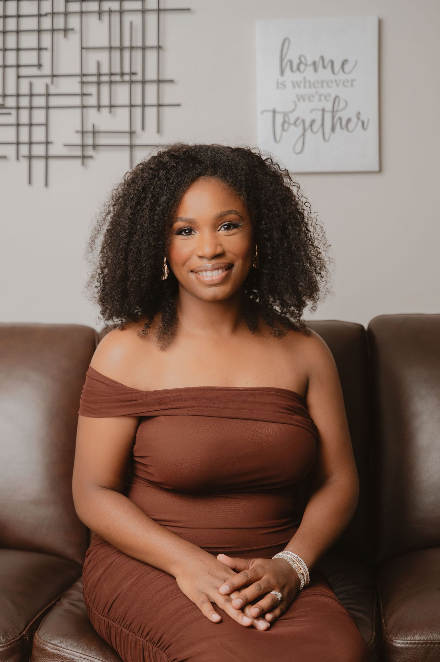 Professional portrait series showing a person in a brown strapless top posing against a neutral wall with home decor.