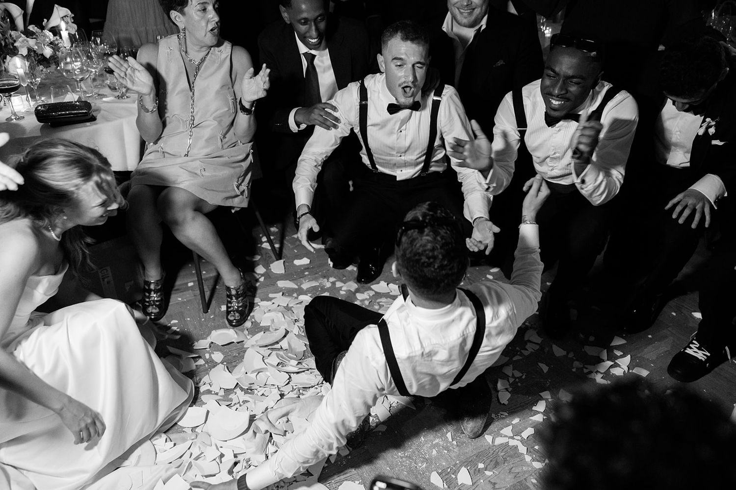 Black and white photos show people dancing and celebrating at what appears to be a lively party or wedding reception.