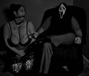 Intimate black and white photography session with dark lighting.