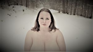 Black and white artistic portrait in a winter forest setting.