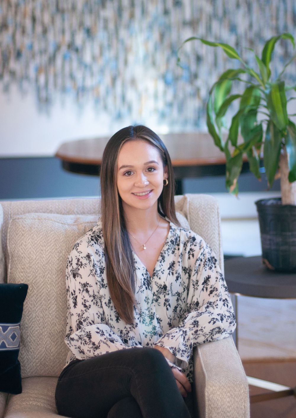 Headshot of a business professional woman in a clean bright setting to use on Linkedin and for networking or promotional materials