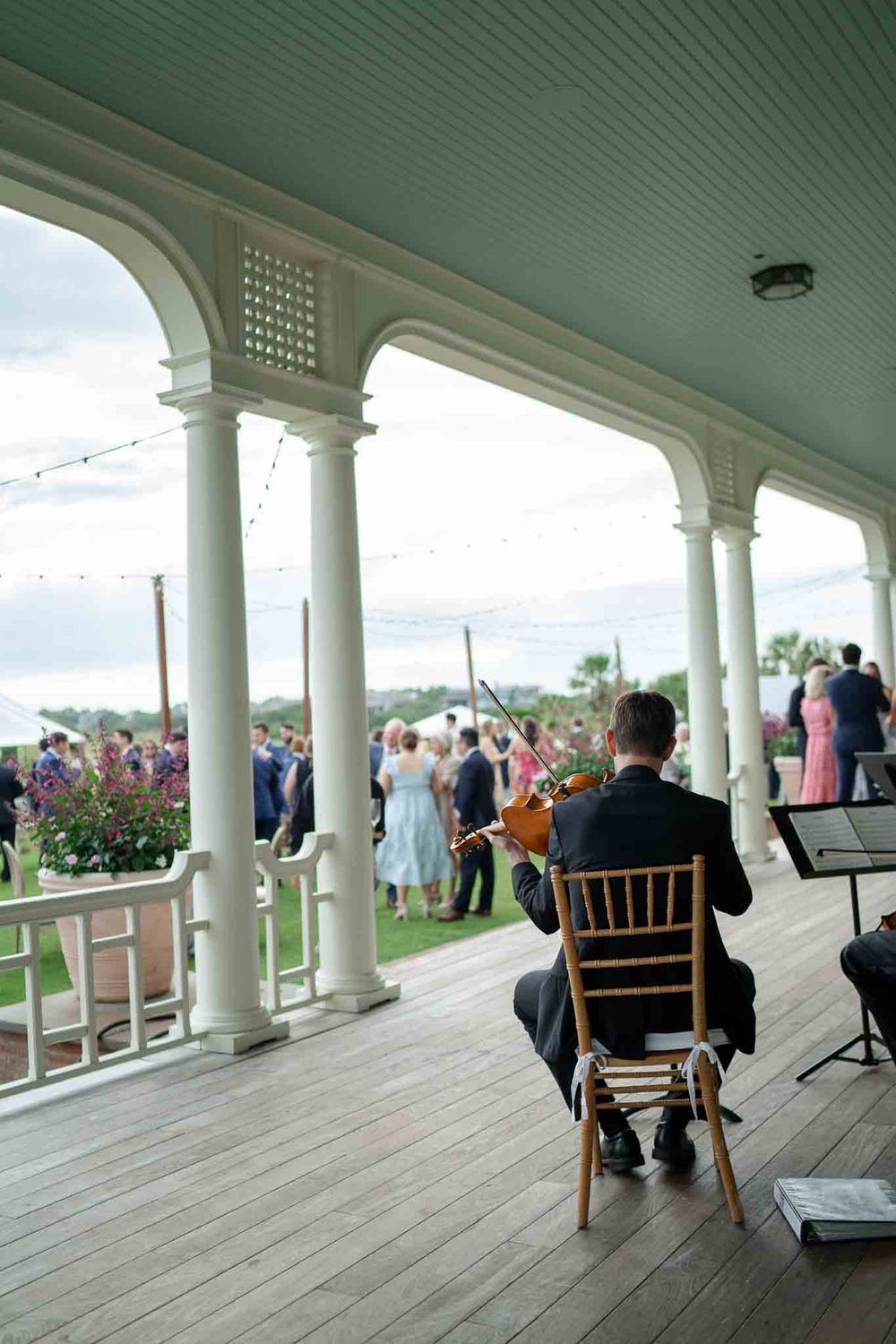 A violinist plays to a wedding reception