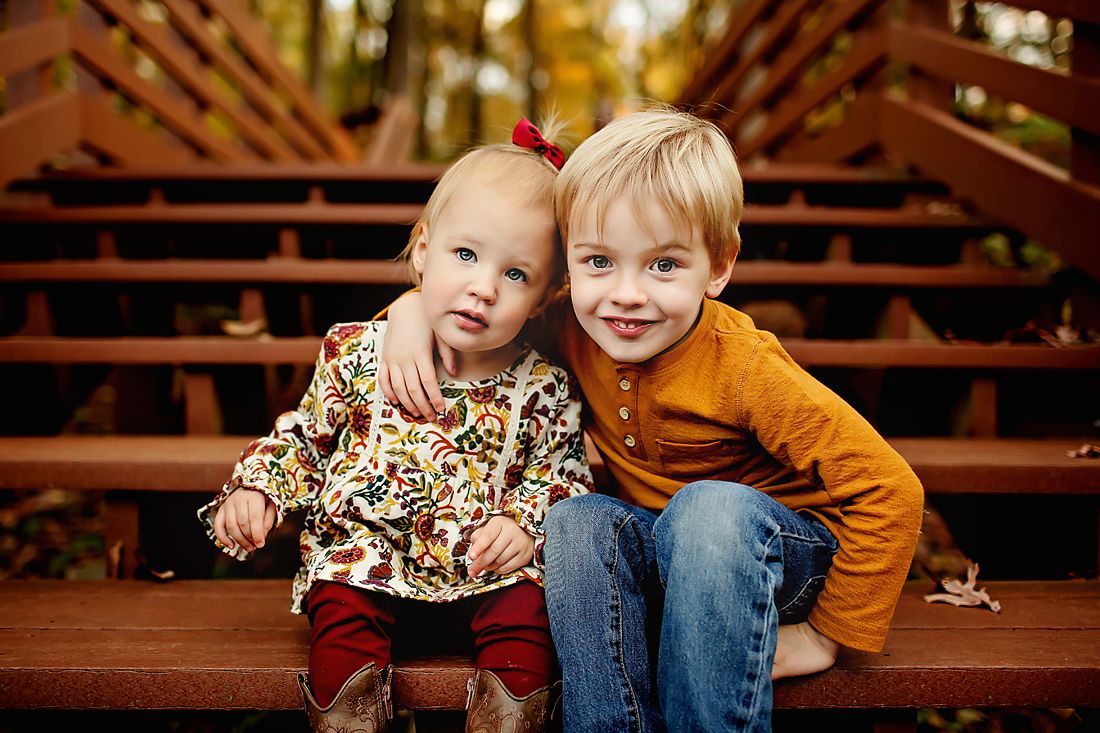 Family hugging during fall photography session in Springfield MO.