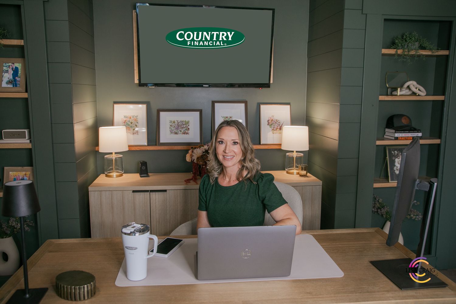 A dark green wall display in a country-style retail store showcasing various home decor items and merchandise.