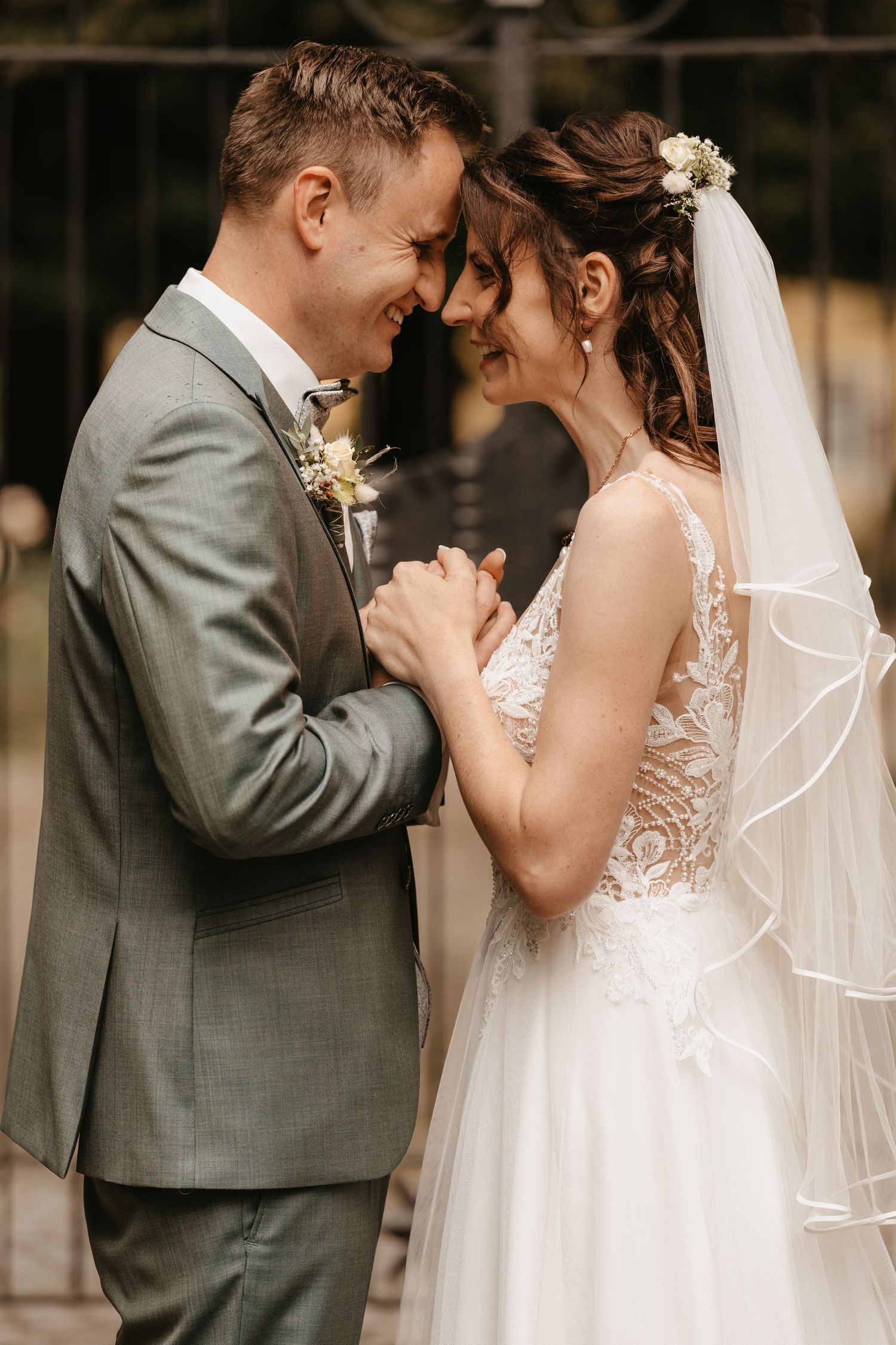 A romantic wedding moment captured in a series of intimate poses between a bride in white and groom in gray.