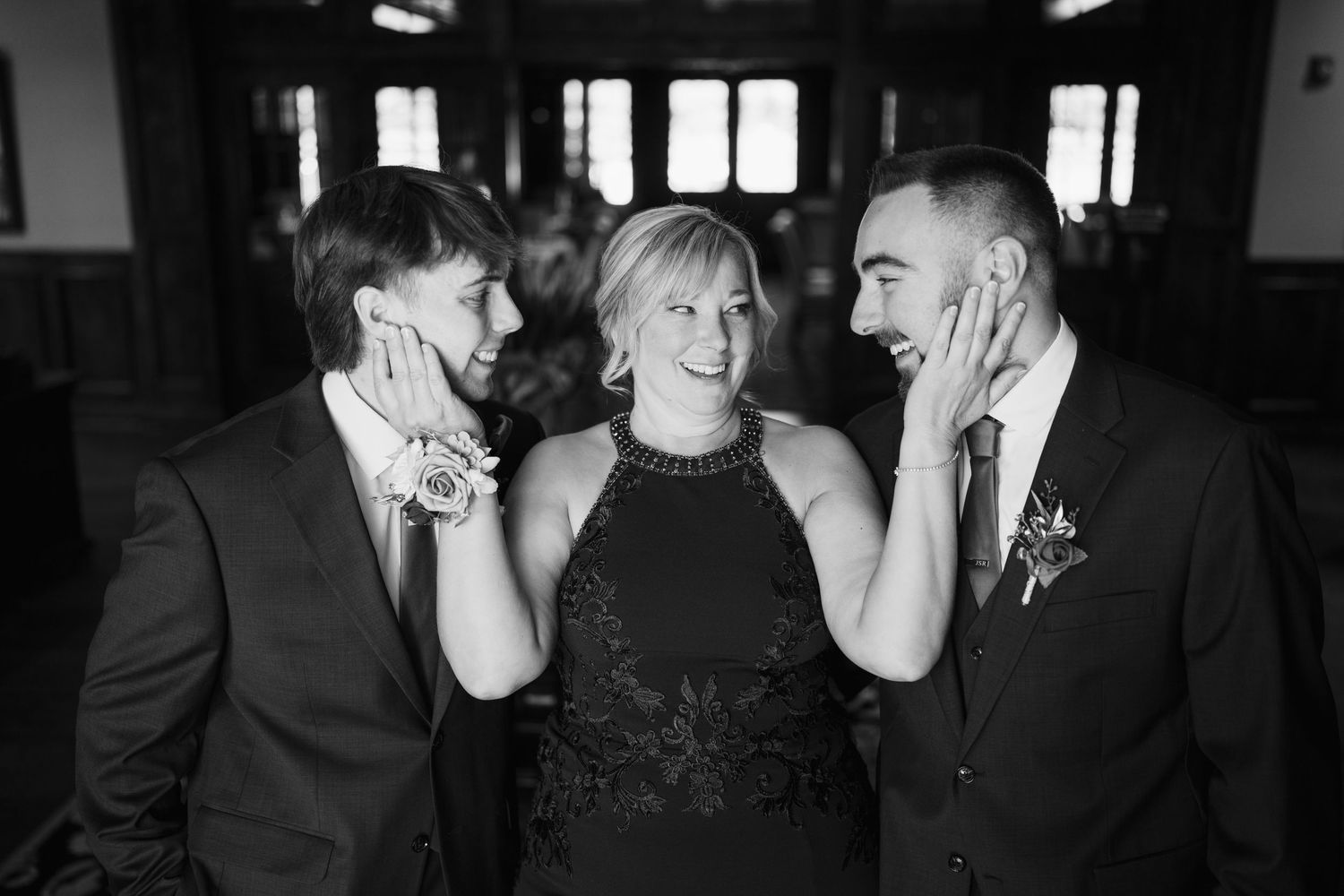 A black and white photo strip showing four candid moments of a couple interacting at what appears to be a party or event.