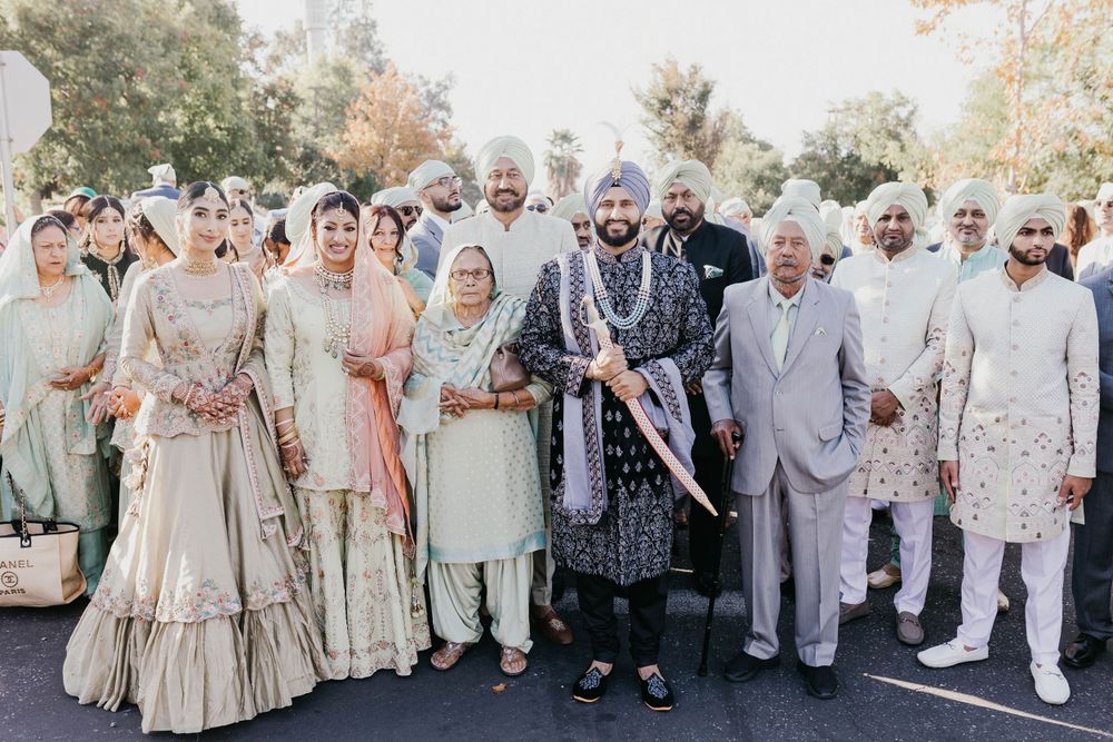 Wedding party group photo with coordinated cream and white formal attire.