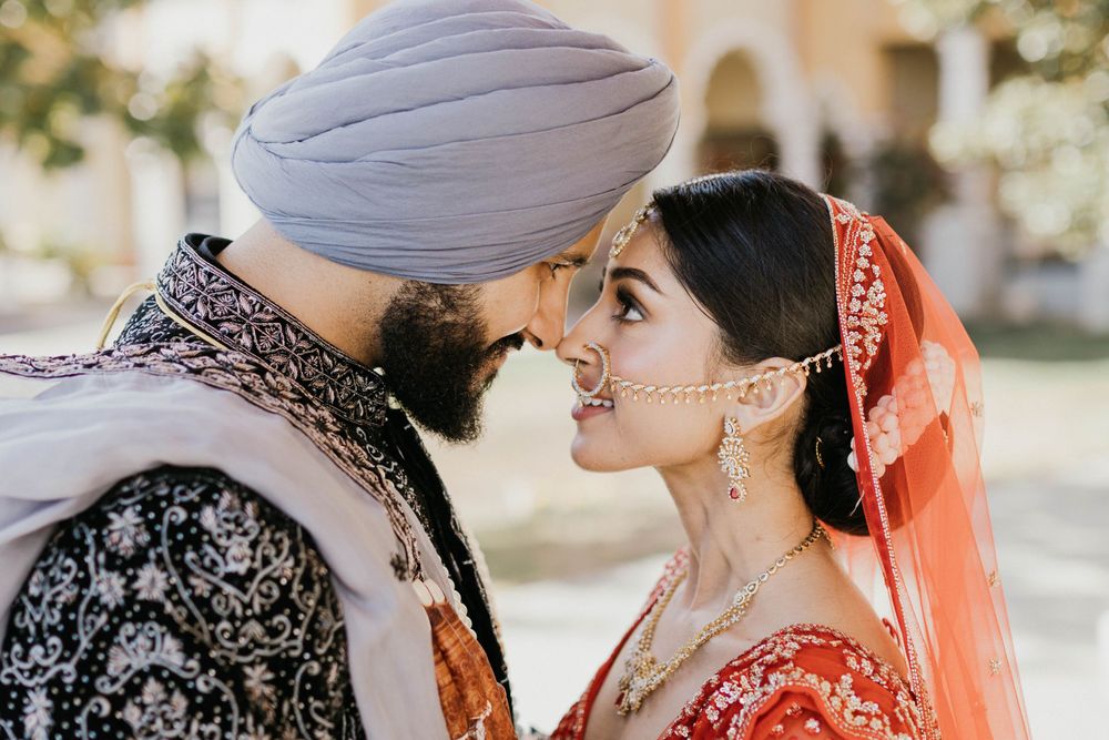Candid wedding photos capturing romantic moments between a couple in traditional Sikh wedding outfits.