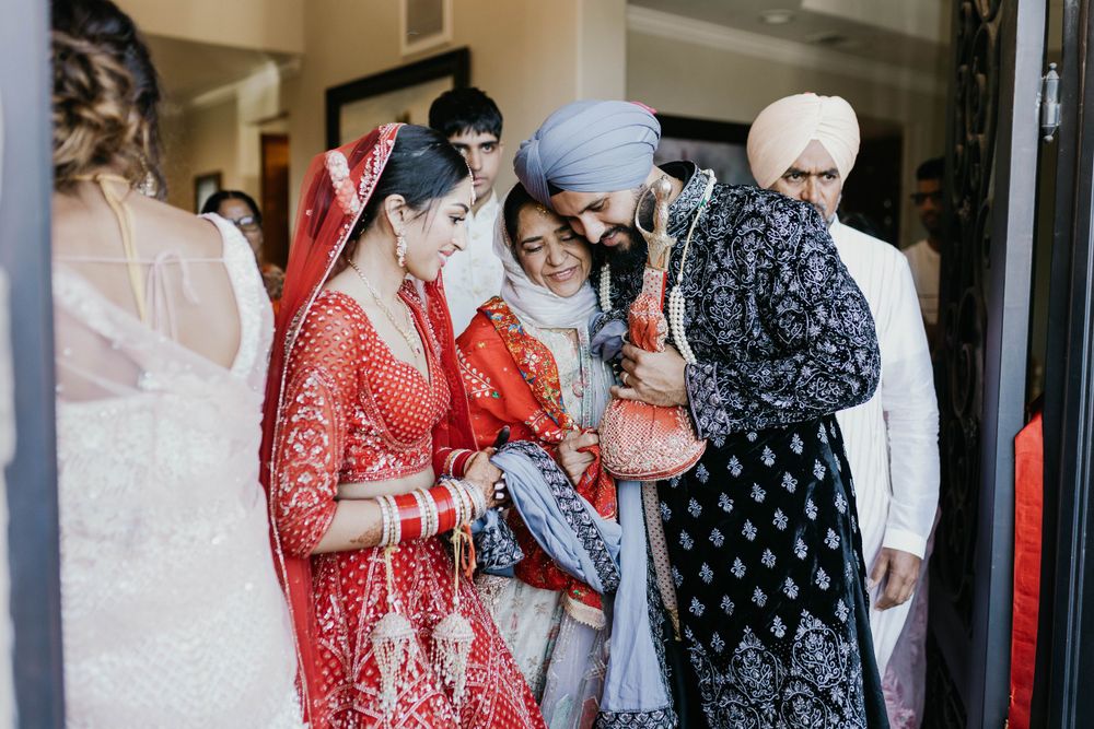 Wedding celebration with guests in traditional Indian attire gathered outdoors.