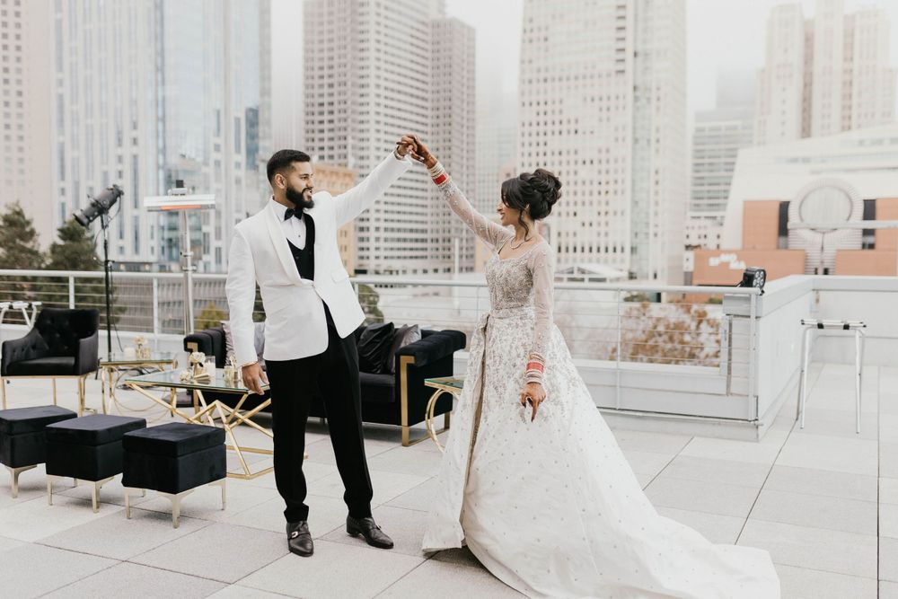 Black and gold decor elements arranged on a modern rooftop wedding venue.
