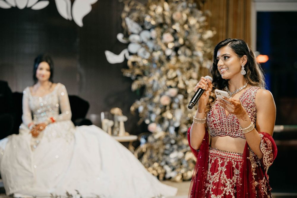 Elegant winter wedding reception with white floral decor and glowing lights.