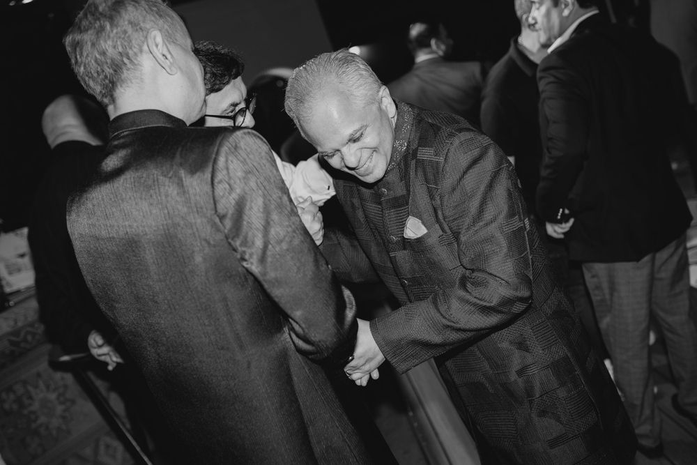 Black and white photos capturing joyful moments of dancing at a celebration.