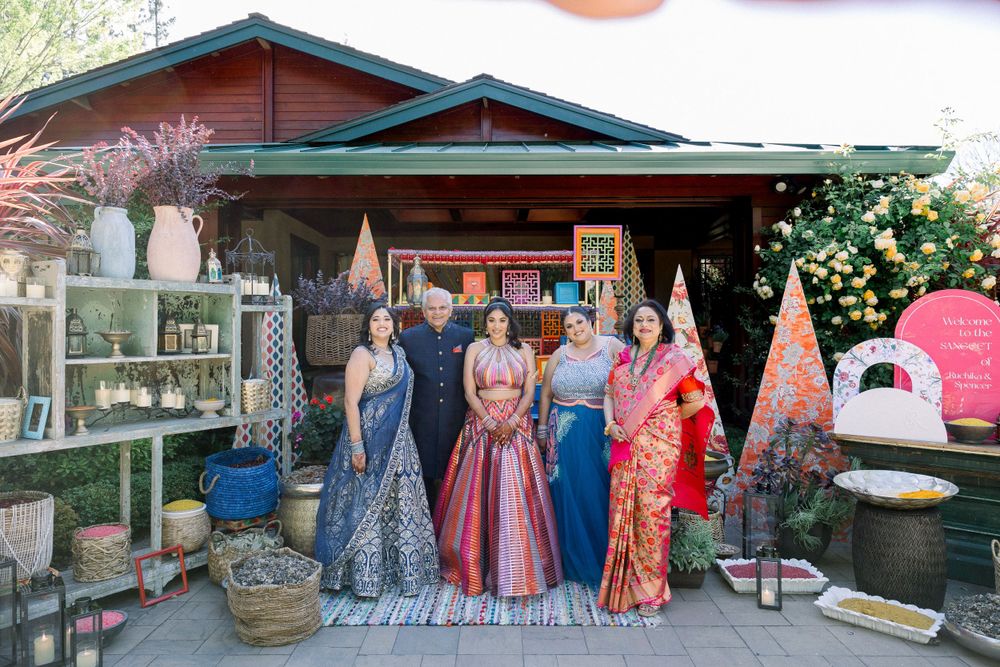 Outdoor venue decorated for special occasion with string lights and garden elements.