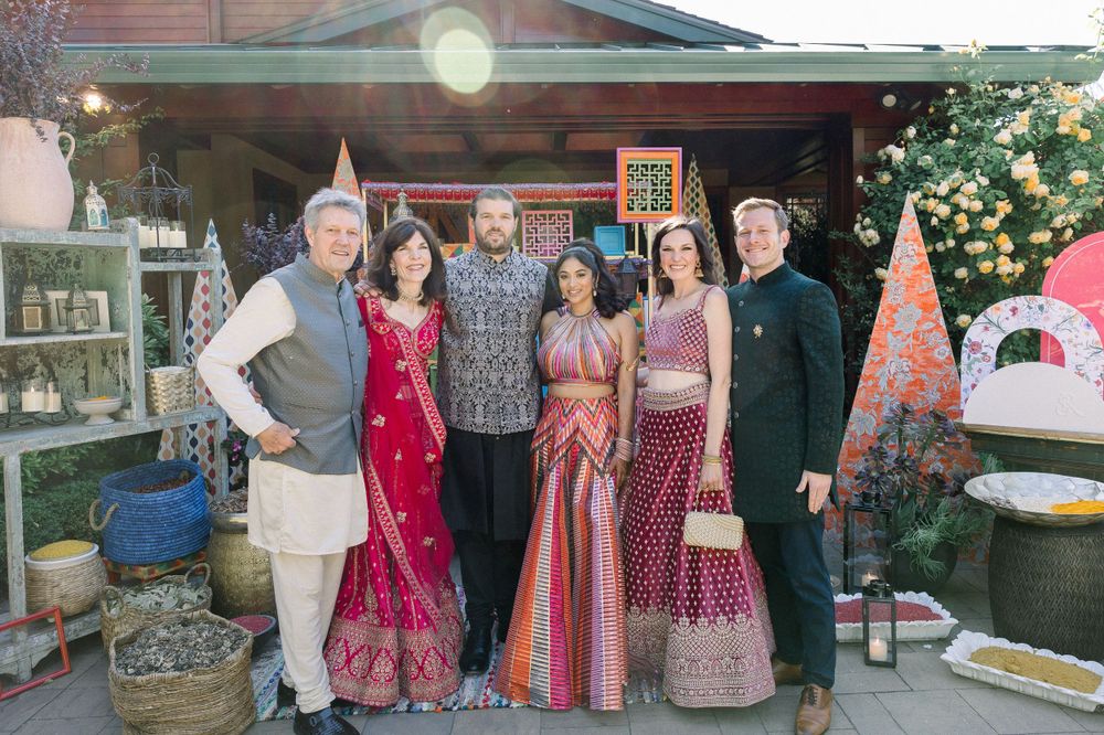 A group enjoying a colorful outdoor gathering with pink and floral decorations.