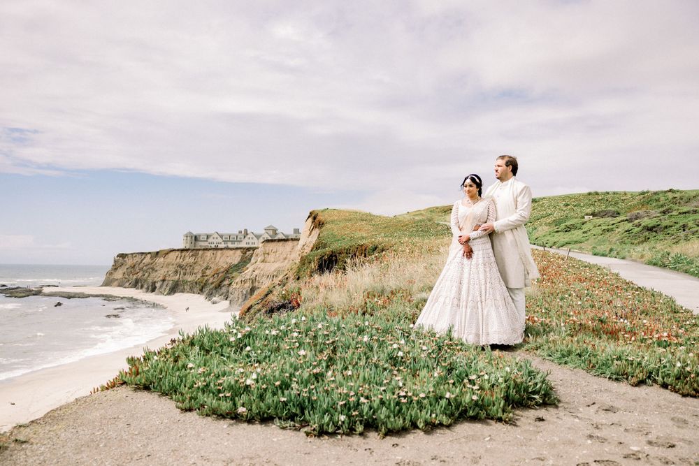 Coastal cliffside wedding venue with natural landscaping and ocean views in the background.